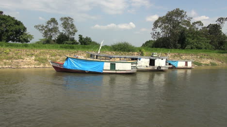 Brazil-Amazon-backwater-near-Santarem-three-boats-by-bank-s