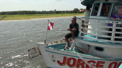 Brazil-Amazon-backwater-man-on-baot-named-Jorge-s