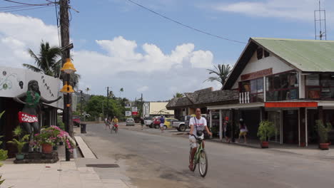 Bora-Bora-a-street-scene-with-cars-and-bicycles-in-Vaitape
