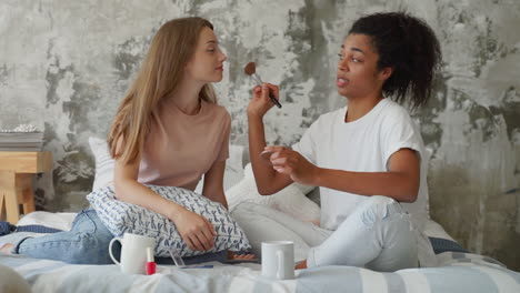 Two-Female-Friends-Learning-To-Apply-Make-Up