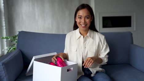 Female-Influencer-Doing-Unboxing,-Showing-New-Running-Shoes