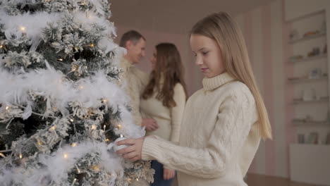 Girl-Play-With-Balls-And-Decorations-Of-Christmas-Tree