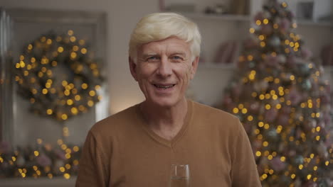 Old-Happy-Man-Looking-At-The-Camera-And-Toasting
