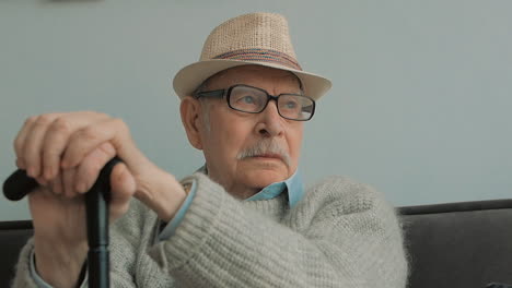 Old-Man-With-Gray-Mustache,-Hat,-Glasses-And-Cane