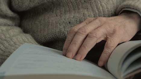 Elderly-Man-Hands-Reading-A-Book