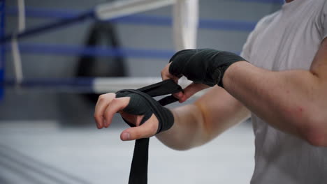 Close-Up-Of-Hand-Wrapping-With-Boxing-Bandages-Before-Training