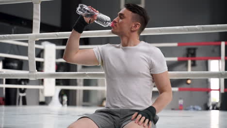 Strong-Athlete-Man-Takes-A-Break-And-Drinks-Water