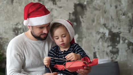 Father-And-Little-Son-Prepare-Christmas-Gifts-1