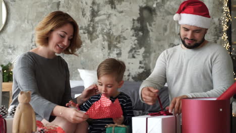 Mother,-Father-And-Little-Son-Prepare-Christmas-Gifts-1