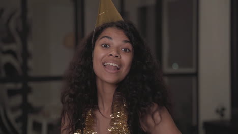 Portrait-Of-A-Pretty-Black-Girl-Making-Funny-Faces,-Dancing,-Throwing-Confetti-At-Christmas-Party