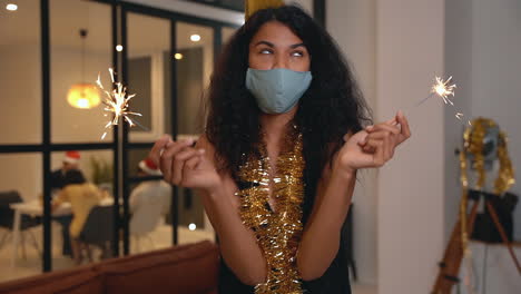 Pretty-Black-Girl-With-Face-Mask-Making-Funny-Faces-At-New-Year's-Eve-Party