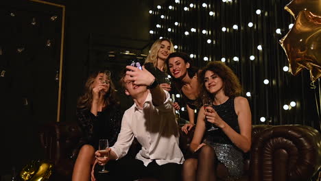 Group-Of-People-Take-A-Selfie-At-A-New-Year's-Eve-Party