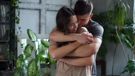 Young-Man-Hugging-Woman-From-Behind