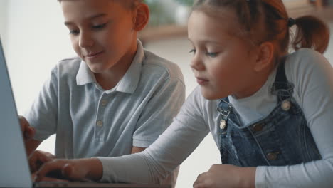 Little-Boy-And-Girl-Playing-And-Researching-With-A-Computer