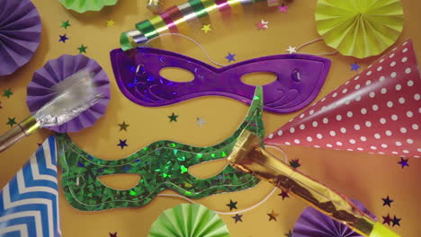 Party-Hats,-Noisemakers,-Carnival-Masks-And-Colorful-Decorations