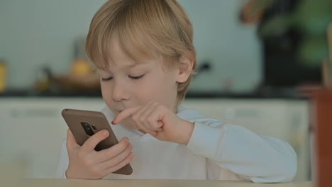 Child-With-Phone-Using-Apps-At-Home-1