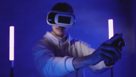 Male-Using-A-Vr-Headset-On-A-Colorful-Neon-Light-Background-1