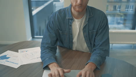 Young-Red-Haired-Man-Working-From-Home-Typing-With-Laptop