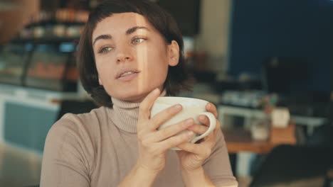 Portrait-Of-Female-Having-A-Cup-Of-Coffee