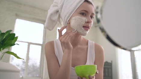 Woman-Applying-Scrub-For-Skin-Care