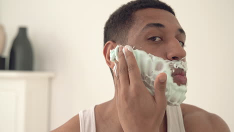 Portrait-Of-Handsome-Black-Man-Applying-Shaving-Foam