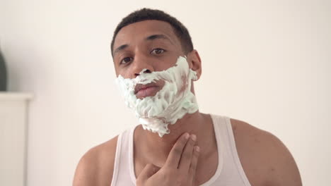 Portrait-Of-Handsome-Black-Man-With-Foam-Shaves-With-Razor