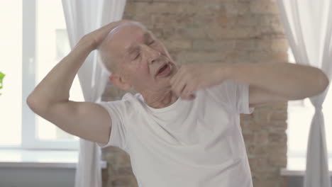 Old-Man-Stretching-And-Exercising-At-Home