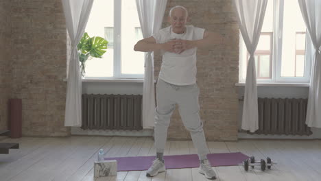 Old-Male-Exercising-And-Stretching-At-Home