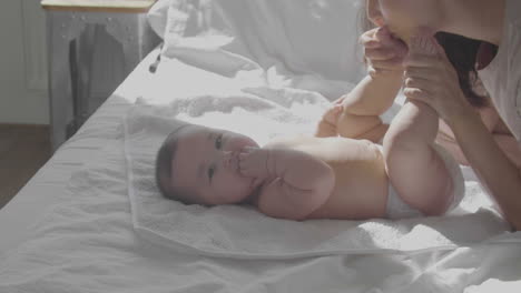 Cute-Happy-Baby-Laying-In-Bed