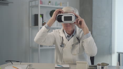 A-Grey-Haired,-Middle-Aged-Doctor-Tests-And-Adjusts-Vr-Glasses
