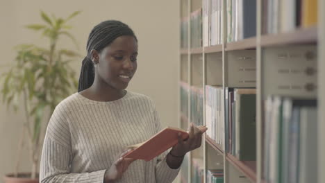 Pretty-Black-Woman-Reading-A-Book-In-The-Library