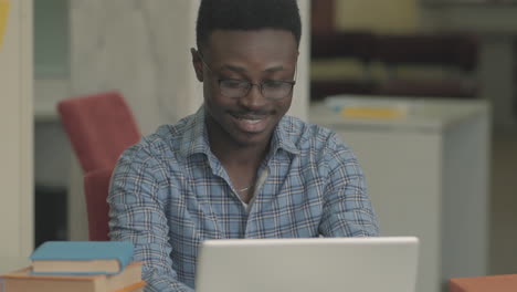 Black-Student-Boy-Typing-On-A-Laptop-1
