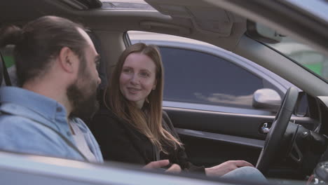 A-Very-Happy-Bearded-Man-And-A-Very-Happy-Beautiful-Woman-Take-A-Selfie-Inside-A-Car