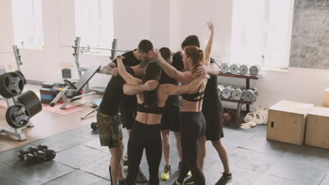 A-Gym-Group-Embraces-Each-Other-In-Motivation-Before-A-Training-Session