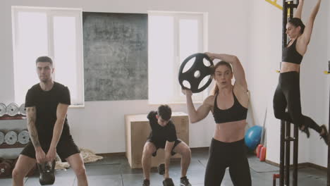 A-Crossfit-Group-Made-Up-Of-Women-And-Men-Work-On-Different-Exercises