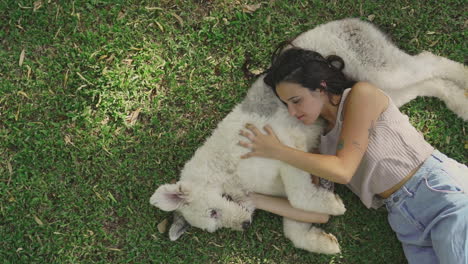 Young-Woman-Pets-A-Big-Dog-Lying-On-The-Grass-2