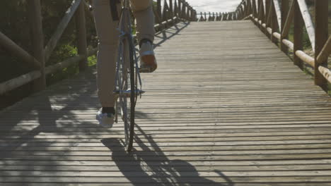 Bike-Wheels-Close-Up-On-A-Boardwalk-Towards-The-Beach