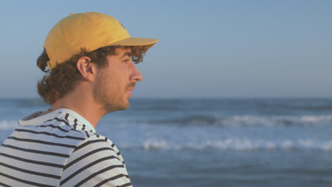 Portrait-Of-Athlete-Man-With-Cap-Looking-At-Sea
