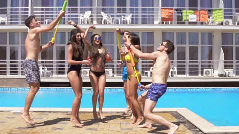 Happy-Young-Cheerful-Friends-Dancing-And-Having-Fun-At-The-Pool-2