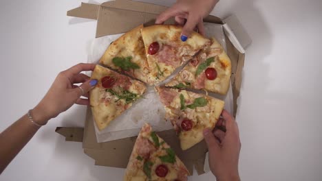 Top-View-Portrait-Of-People-Hands-Taking-Slices-Of-Pizza,-Group-Of-Friends-Sharing-Pizza-Together,-Colleagues-Ordered-Pizza-In-The-Work-Place-During-Break-Time
