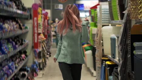 Woman-Funny-Dances-In-Supermarket-Between-The-Rows