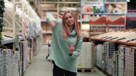 Longhaired-Woman-Dances-In-Hardware-Store-Between-The-Rows