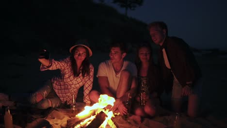 Picnic-Of-Young-People-With-Bonfire-On-The-Beach-In-The-Evening-4