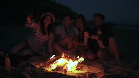 Picnic-Of-Young-People-With-Bonfire-On-The-Beach-In-The-Evening-5