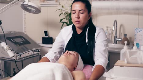 Female-Cosmetologist-Is-Making-Neck-Massage-In-Spa-Salon