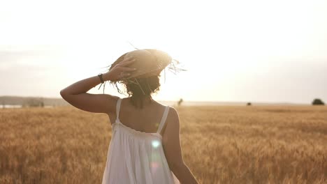 Happy,-Slender-Girl-In-Straw-Hat-And-Summer-White-Dress-Happily-Running-In-Clear-Wheat-Field