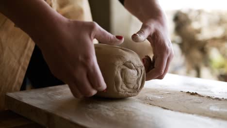 Unrecognizable-Woman-Cutting-The-Clay-Before-Begin-Sculpting-Close-Up-In-Workshop