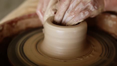 Close-Up-Footage-Of-A-Woman-Sitting-At-Pottery-Wheel-In-Ceramics-Studio-Shaping-Clay-Vase-Shot-In-Slow-Motion-1