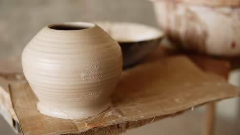 The-Female-Potter-Finished-Making-A-Clay-Vase-Remove-It-From-The-Potter's-Wheel