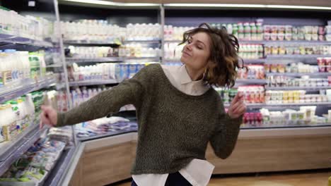 Young-Woman-Dancing-Through-Grocery-Store-Aisles